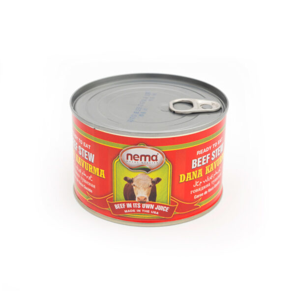 Can of Nema Dana Kavurma beef stew with red label, featuring cow illustration and “Beef in its own juice” text.
