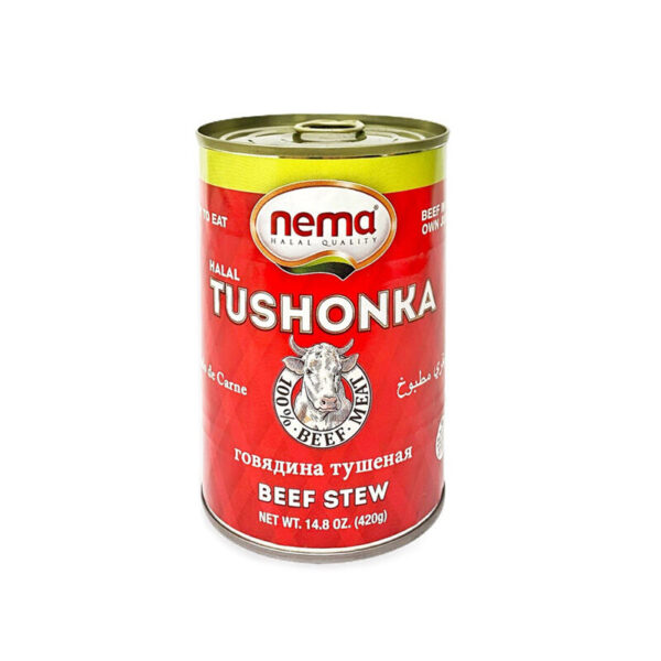 Can of Nema Halal Tushonka stewed beef with red label featuring cow illustration and product name in multiple languages.